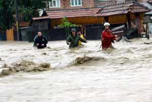 Rescuers and locals push through the floodwater in Eastern Romania; photo courtesy of Balkan Inside, used under Creative Commons license. 