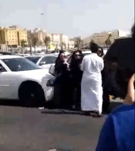 A screenshot from the video which shows the scuffle between the man and the girls 