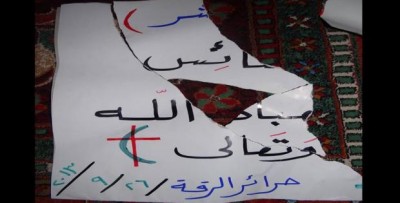 Suad Nofal´s banner, in solidarity with the Christian population, torn by ISIS. Source: Suad Nofal´s facebook page