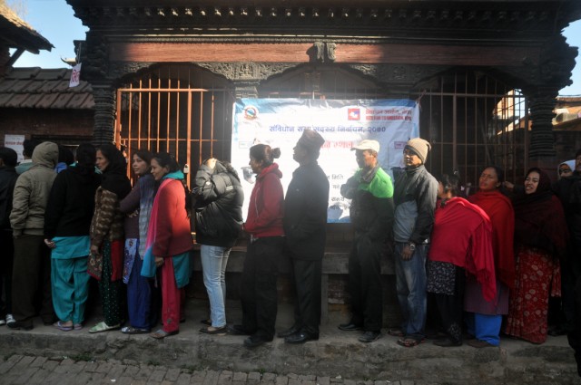 Voters queuing outside a polling station in Kirtipur, Kathmandu, Nepal. Photo by anuj arora. Copyright Demotix (19/11/2013)