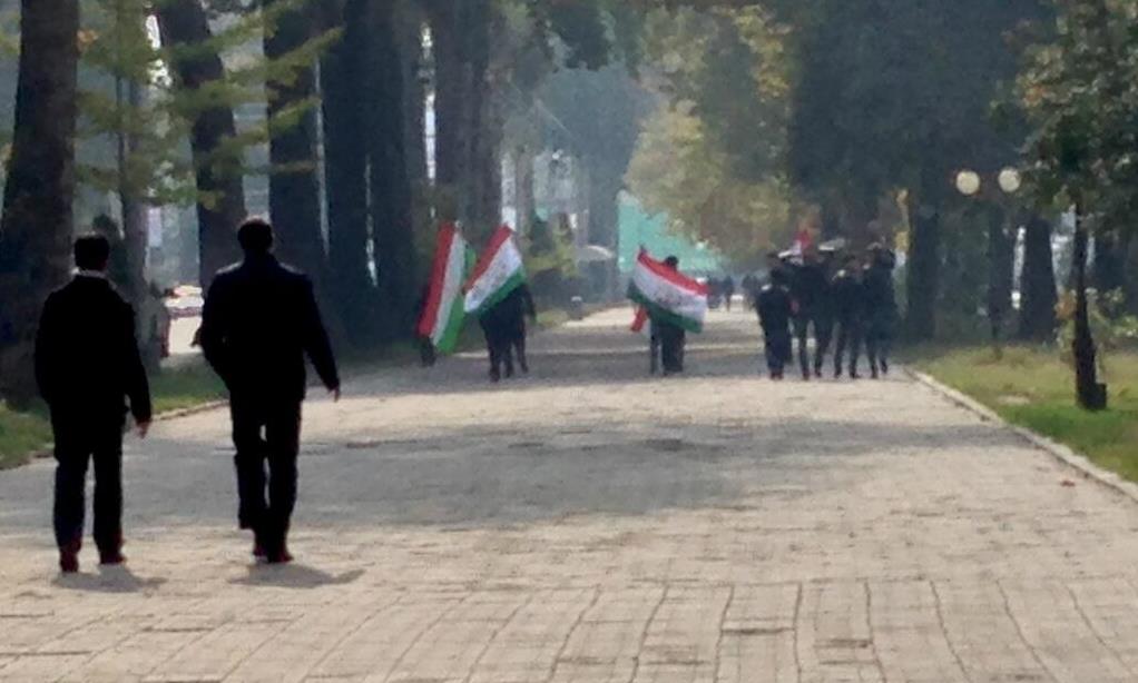People carrying national flags on the election day in Dushanbe. Image by Aaron Huff, used with permission.