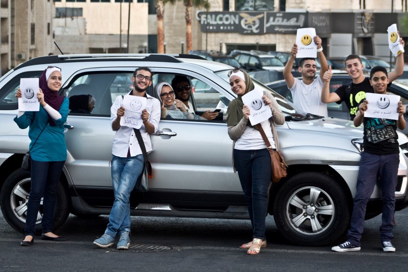 Giving out free smiles to people on Traffic lights. Taken from the Humans of Amman page