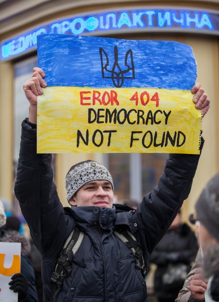 A protester on Maidan Nezalezhnosti holds a sign. Dec. 1, 2013. Photo by Alexandra Gnatoush. Used with permission.