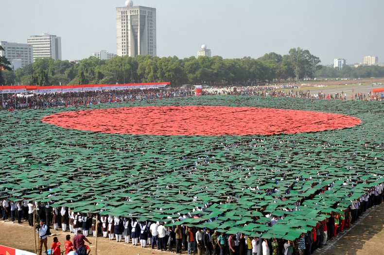 The world’s largest human national flag of Bangladesh being created at the National Parade Ground in Dhaka on 16 December, 2013, marking the Victory Day. Image by Indrajit Ghosh. Copyright Demotix (16/12/2013)
