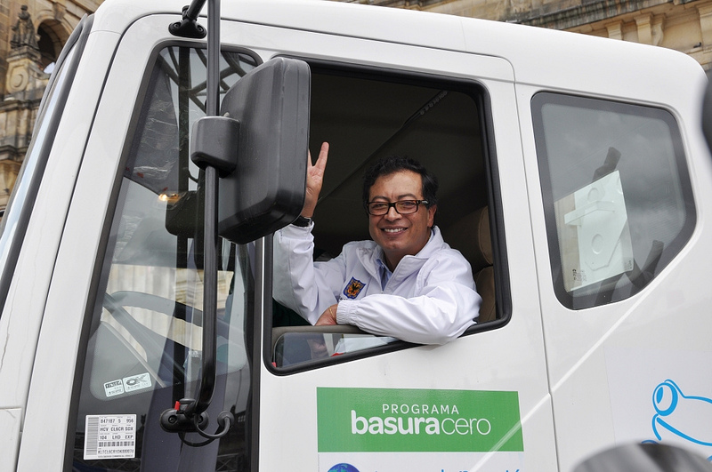 Bogotá's Mayor Gustavo Petro riding a waste collector truck, part of his 'Basura Cero' (Zero Trash) programme. Photo shared by Bogotá Humana on Flickr under a Creative Commons license (CC BY-NC 2.0) 
