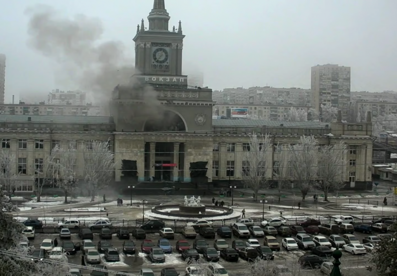 Volgograd's central train station billowing smoke after Sunday's deadly explosion. The iconic white fountain in the front was destroyed during the battle for Stalingrad (Volgograd's former name). The image is reminiscent of a war movie. YouTube screenshot.