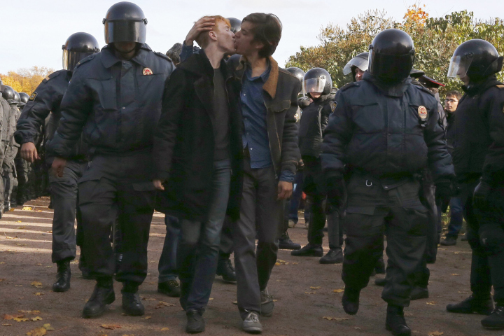 Gay rights activists kiss as they are detained by police officers during a gay rights protest in St. Petersburg, Russia, 12 October 2013, photo by Jordi Bernabeu Farrús, CC 2.0.