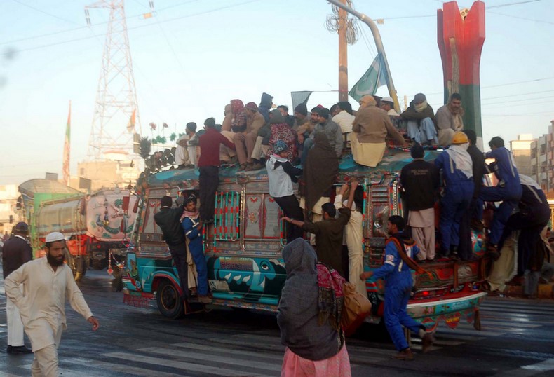 Passengers travel on an overloaded bus during a transportation shortage due to a lack of CNG as the filling stations are closed in Karachi, Pakistan. Image by ppiimages Copyright Demotix (2/1/2013)