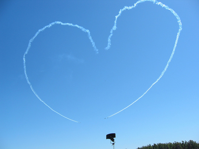 The shape of a heart created by smoke trails at the Ottawa air show. By Flickr user ASPatrick 