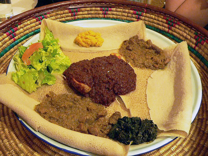 Ethiopian/Eritrean injera (flat bread), which can be eaten with dishes such as Doro wet. Photo released under Creative Commons by Wikipedia user Rama.