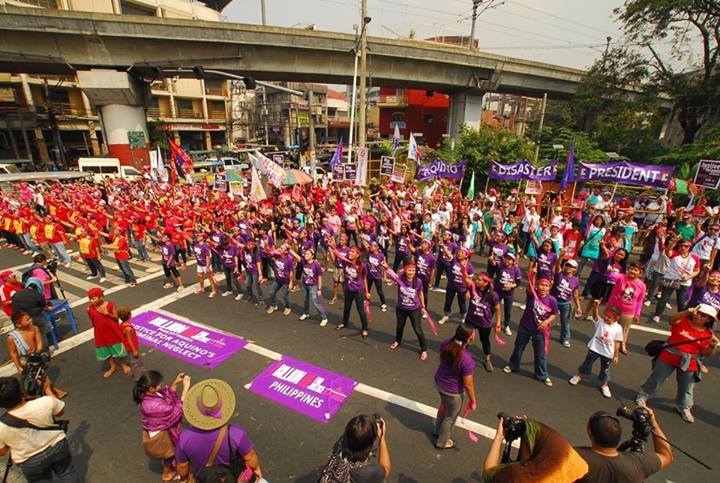 Filipino activists hold a 'One Billion Rising' dance protest near the Philippine presidential palace to push for greater subsidy to social services. 