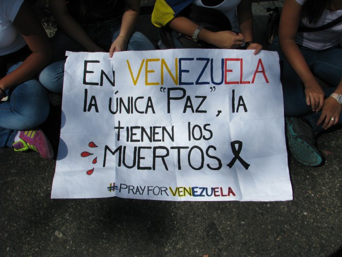 In Venezuela the only “peace” is had by the death. #PrayforVenezuela. Photo by Kira Kariakin.