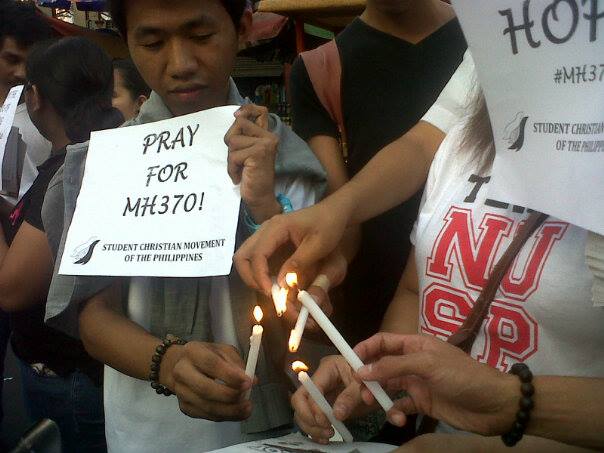 Filipino students hold a candle lighting ceremony in honor of passengers of MH370. Photo from Kathy Yamzon