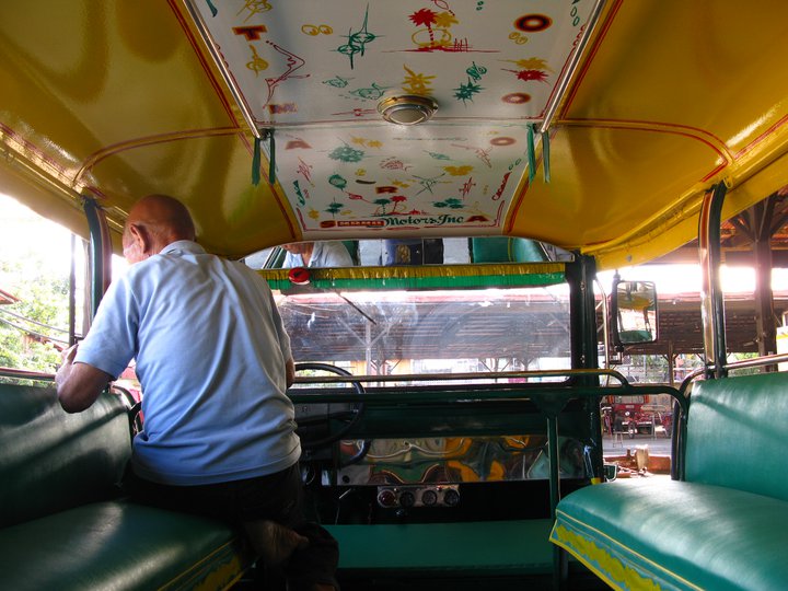An artist paints inside a jeepney. Facebook photo from Sarao