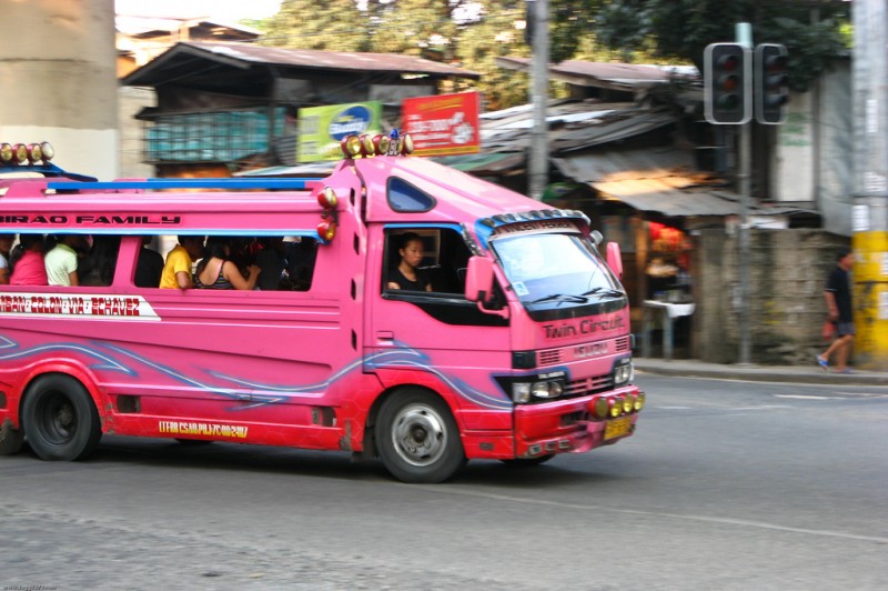 A pink jeepney with a different structural design. Flickr photo by dbgg1979 (CC License)