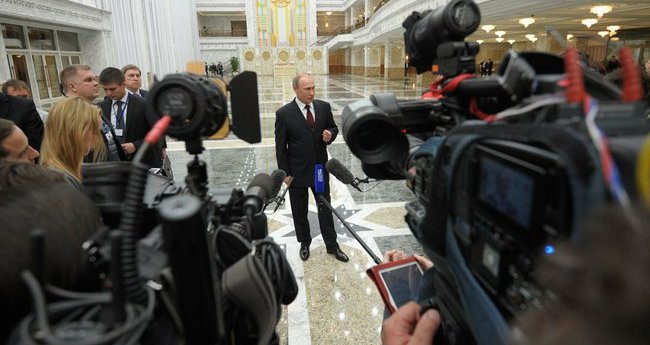 Vladimir Putin speaks to the press at a conference in Minsk, April 29, 2014, Kremlin photo service, public domain.