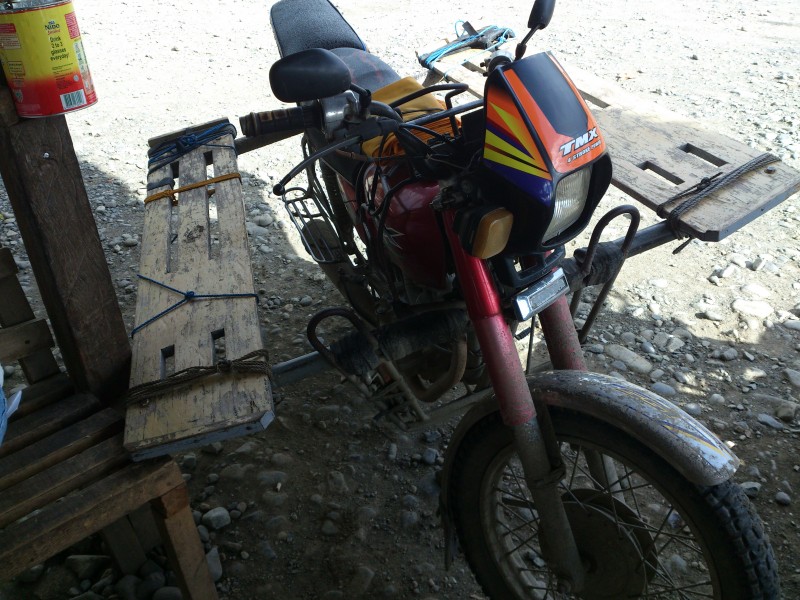 This Habal-Habal has extensions consisting of wooden planks across the seat of the motorcycle. Photo by Sherbien Dacalanio, Copyright @Demotix (9/8/2012)