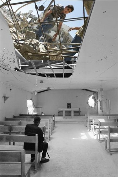 One of the few remaining refugees after the civil strife in Jisr el-Basha camp, passes a quiet moment in the partly damaged Pontifical Mission Church, Lebanon 1976. UNRWA photo archive Palestinian Presidential Headquarters (al-Muqat’a), Ramallah 2002., by Jamal Arouri