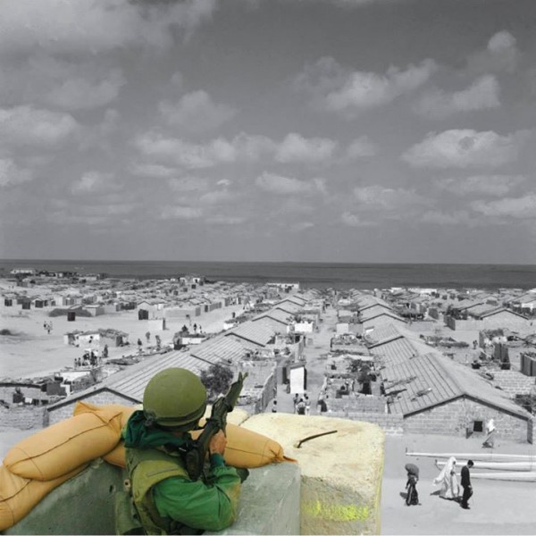 Beach refugee camp, Gaza Strip UNRWA photo archive.  An Israeli soldier at Qalandiya checkpoint. 20 Apr. 2002, by Alexandra Boulat