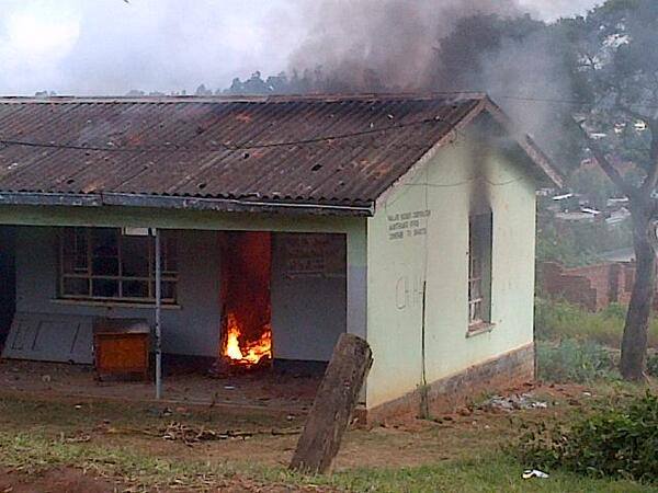 A polling centre in Malawi burns. Photo by Albert Sharra. Used with permission.