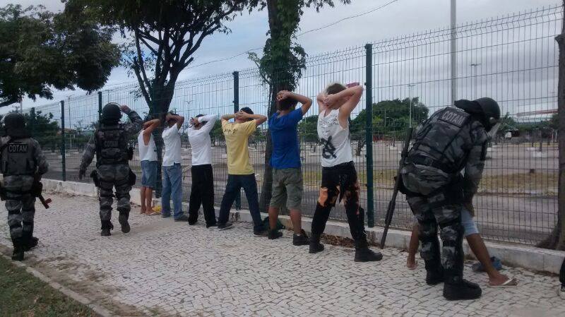 Heavily armed and unidentified police officers search protesters in Fortaleza before the game. Photo shared by platform Na Rua on Facebook. 