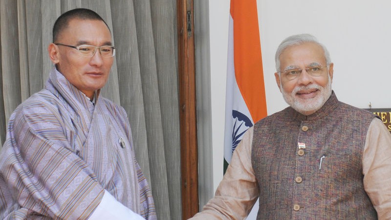 Newly sworn-in Prime Minister Narendra Modi (R) shakes hands with Bhutan Prime Minister Tshering Tobgay during a meeting in New Delhi. Image by Amit Kumar. Copyright Demotix (27/5/2014)