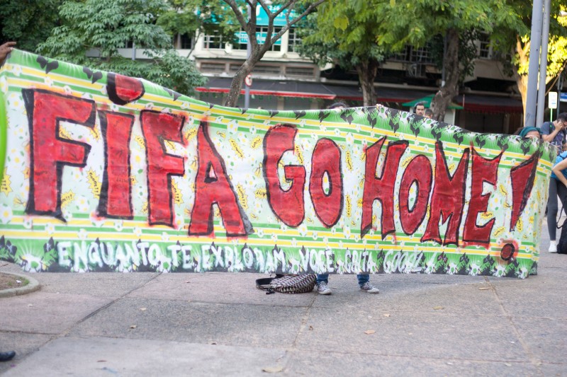 A banner reads "FIFA go home" during a protest in Rio de Janeiro against the hosting of the 2014 FIFA World Cup in Brazil. June 15, 2014. Photo by Nicson Olivier. Copyright Demotix.