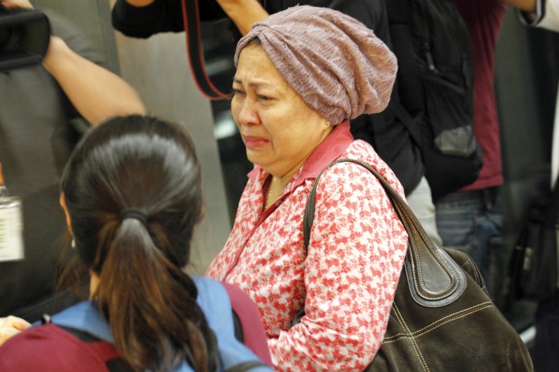Family members rushed to Kuala Lumpur International Airport when informed about the flight MH17 crash. Photo by Danny Chan, Copyright @Demotix. (7/18/2014)