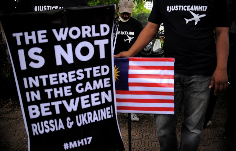 Malaysian protesters gather during a rally demanding justice for the victims of MH17 crash. Photo by Hafzi Mohamed, Copyright @Demotix (7/22/2014)