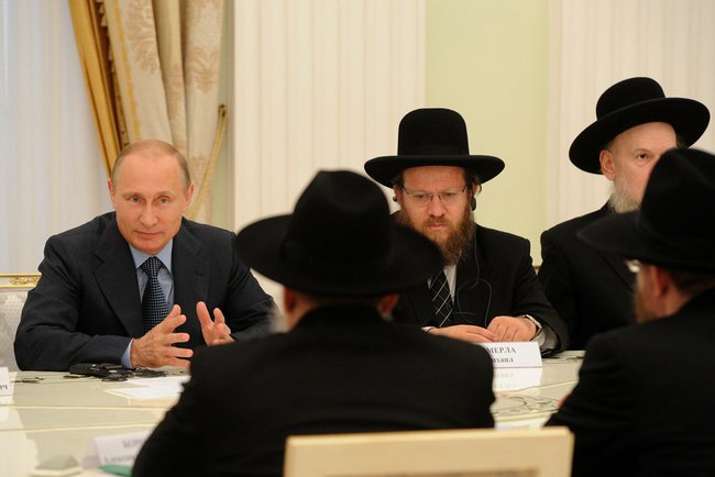 Vladimir Putin meets with religious officials, July 9, 2014, Moscow, Russia. Kremlin Press Service, Public domain.
