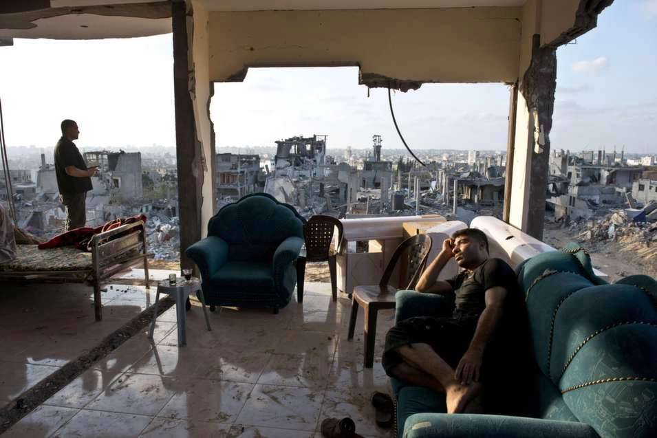 This image, simply entitled "Seen in Gaza" shows two Palestinian men in Gaza overlooking their destroyed city which was destroyed by an Israeli attack