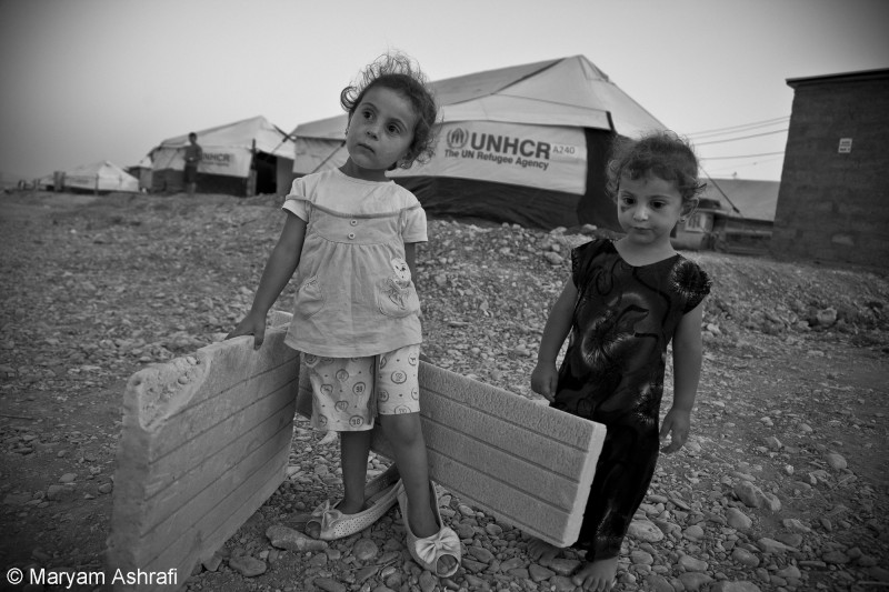 Ashrafi zachytila syrské děti v utečeneckém táboře Arbat v Iráckém Kurdistánu, červenec 2014.