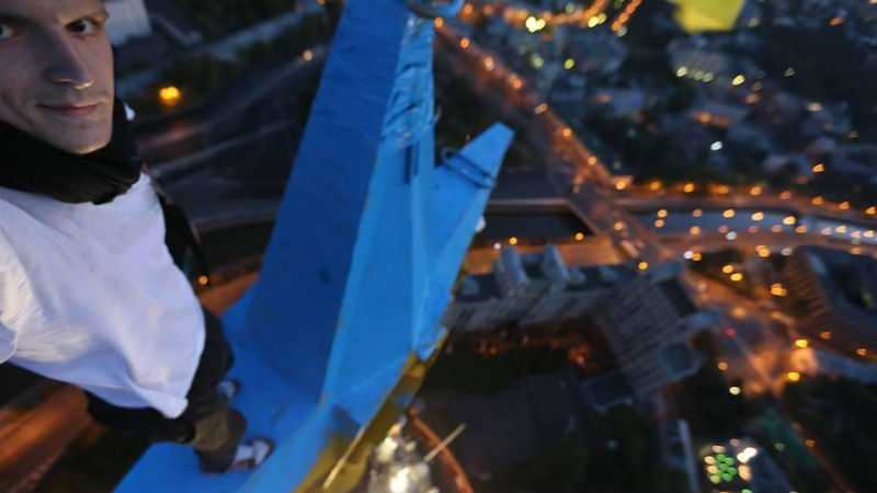Ukrainian Mustang Wanted, who has become an Internet celebrity for his high-altitude stunts around the world, admitted to painting the star in Moscow. Image from Mustang Wanted on Facebook.