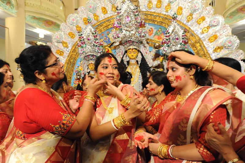 Bengali House wifes play "Sindur Khala" on the last day of the Durga Puja festival at Kolkata in India. Image by Reporter #7585286. Copyright Demotix (14/10/2014)