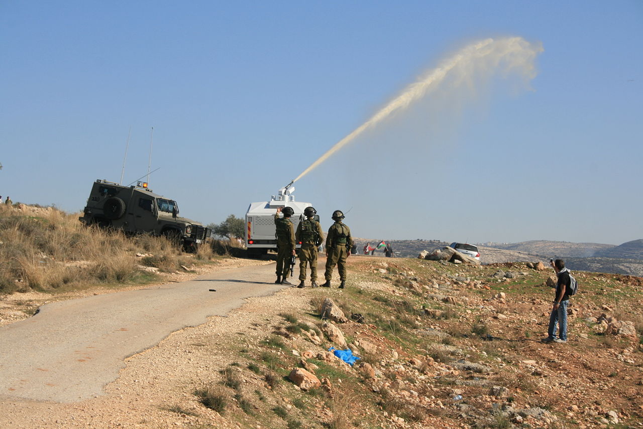 The Skunk liquid being used against Protesters in the Occupied West Bank. (Image by טל קינג, Wikimedia)