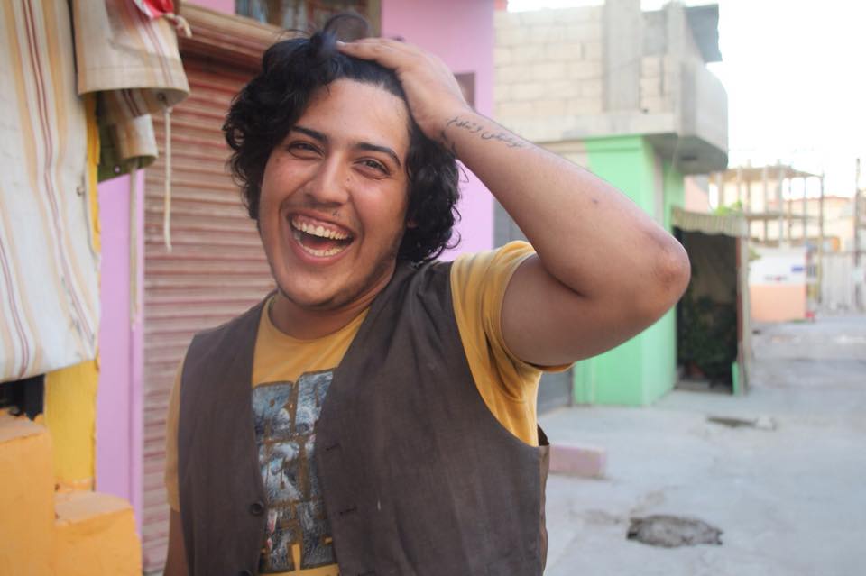 “I work here with the newcomers from Syria, running theatre puppet shows with NGOs all across Lebanon. I’m from Syria too.” What does your tattoo say? “Music and peace.”  Source: Humans Of Al Rashidiya