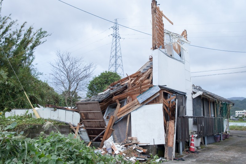 A destroyed house saw its walls and roof on the second floor collapse due to the strong winds in Makurazaki region in Japan. 13 October 2014. Photo by rieko uekama. Copyright Demotix.