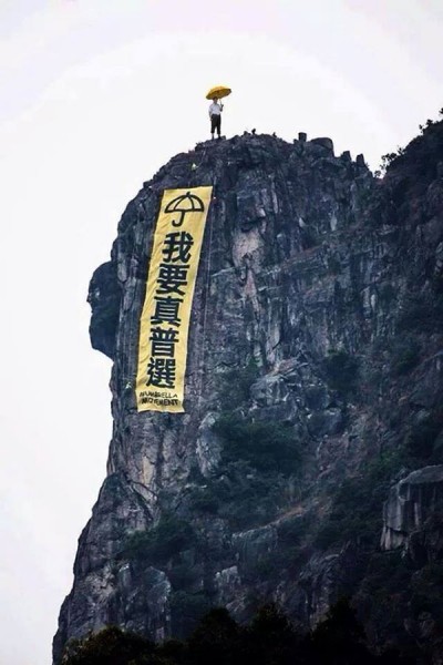 Xi at the top of Lion Rock. Via Tang Earthquake's Facebook