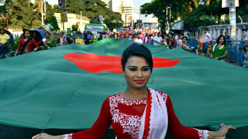 Transgender people parade with the national flag in Dhaka to mark 'Hijra Pride'. Image by Sony Ramany. Copyright Demotix (10/11/2014) 
