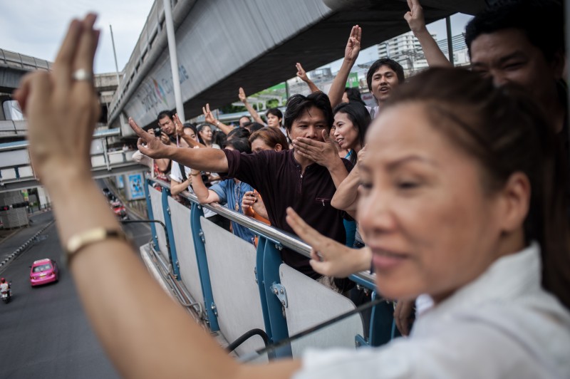 Anti-coup protesters show three-finger sign at Skywalk near Bangkok Art and Cultural Centre. Photo by Yostorn Triyos, Copyright @Demotix (6/1/2014)