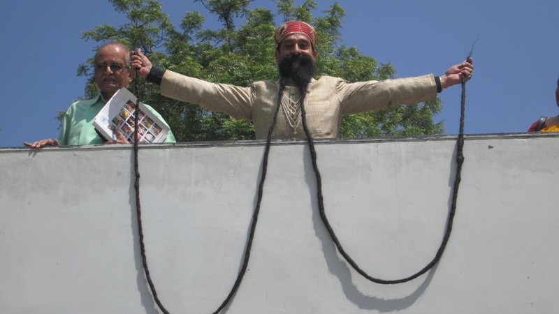 Ram Singh Chauhan from Jaipur honored by World Records India and World Amazing Record Ahmedabad for his 17 Feet Longest Mustache. Image by Paavan Solanki. Copyright Demotix (24/9/2014)