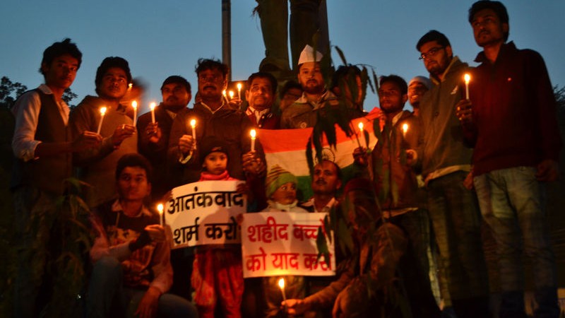 Indian congress workers and children pay tribute to those killed in the Taliban attack in Peshawar, Pakistan at a candle vigil in Allahabad, India. Image by Ritesh Shukla. Copyright Demotix (17/12/2014)