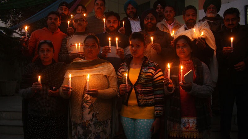 Indian people lit candles as they took part in a candle-light vigil in memory of victims killed in a Taliban attack on a military-run school in Peshawar, in Amritsar. Image by Sanjeev Syal. Copyright Demotix (17/12/2014) 