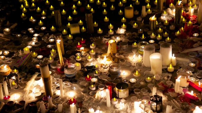 A collection of candles and votives lit as part of a vigil in Trafalgar Square, London, to remember the dead school children and teachers killed by the Pakistani Taliban in Pakistan. Image by Emma Durnford. Copyright Demotix (17/12/2014)