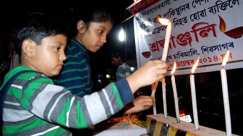 Childrens in Sivasagar, Assam lighting candles protesting the attack of Talibans in a school of Pakistan,  image by Neelam Kakoty Majumdar. Copyright Demotix (18/12/2014)