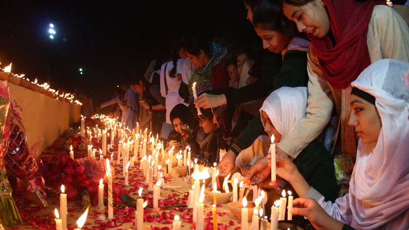 Students of Army Public School, members of Civil Society, Pak Army staffs and large numbers of citizens held a candle light vigil to mourn the innocent victims. Image by ppiimages. Copyright Demotix (19/12/2014)