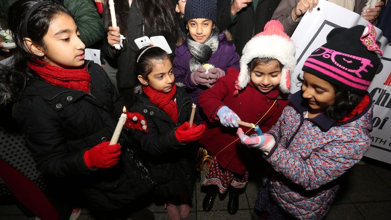 A Candlelight vigil for the children of Peshawar is held in Longsight, Manchester outside the Pakistani Community Centre. Image by Barbara Cook. Copyright Demotix (20/12/2014)