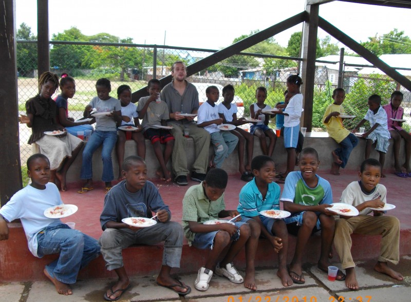 Somers taking a lunch break with some of the kids from the TrenchTown Reading Centre. Photo courtesy the centre, used with permission. 