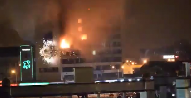 What appears to be heavy artillery hits Grozny's Dom Pechati, where an unknown number of militants are now under siege by local police and military. YouTube. December 3, 2014.