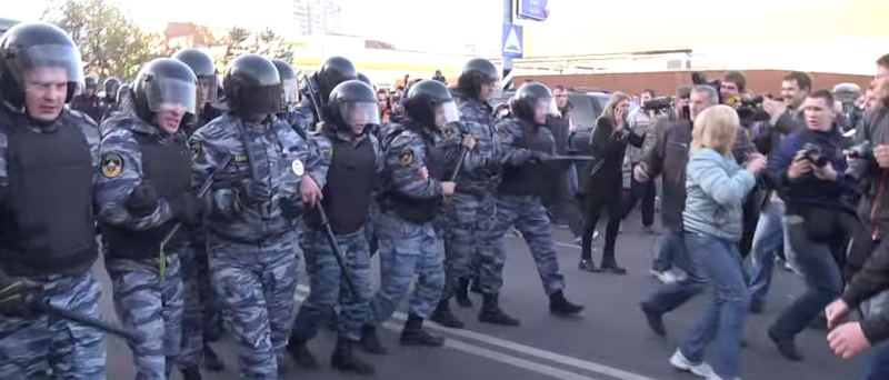 Riot police and demonstrators clash in Biryulyovo, October 13, 2013. YouTube.